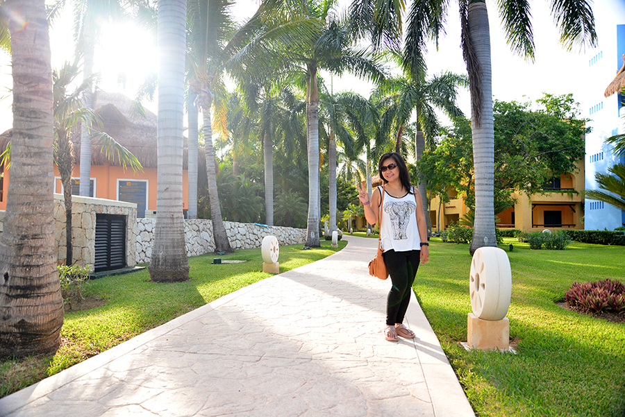 The resort is beautiful with lots of palm trees.
