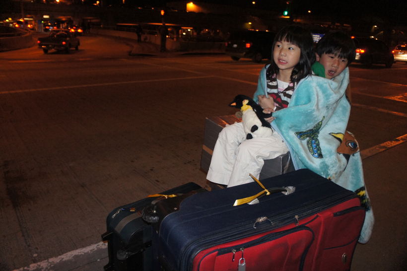 It was so cold outside LAX that the kids were freezing
